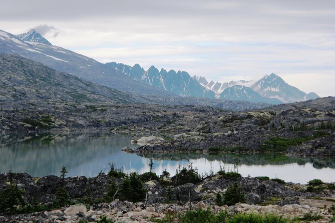 Chilkoot Trail Hike, Float, and Summit Drive - White Pass Summit drive: border trivia, the Welcome to Alaska sign, and hanging waterfalls vibes