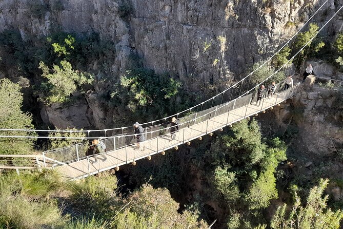 Chulilla Hike to the Hanging Bridges from Valencia - Charco Azul canyon time: calm water, tall walls, and cave-painting context