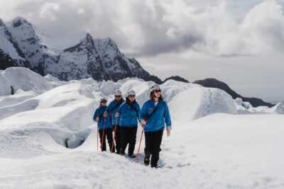 Franz Josef: 2.5 Hour Glacier Hike with Helicopter Transfer - From Glacier Base to the Helipad: Gear Up in Franz Josef Town
