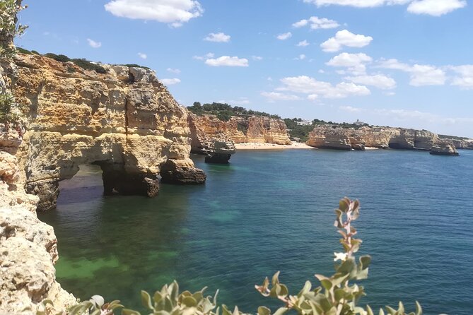 From Faro: Benagil Hiking Cliffs and the 4 Treasure Experience - Stop 1: Praia da Marinha Cliffs and the Bridge, Heart, Titanic Rocks