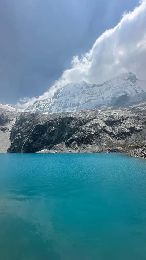 From Huaraz: Hike to the Lagoon 69 - Laguna 69 itself: blue water, big peaks, and a guided hour