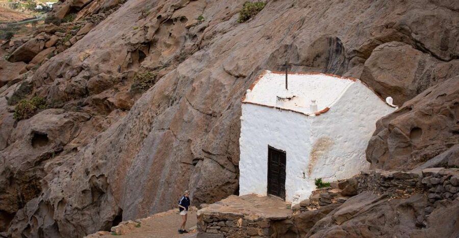 Fuerteventura: Wild Coast and Legends Hike - The black beach and the monolith with a big hole