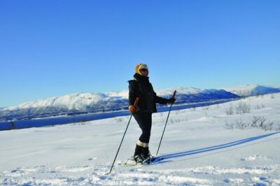 Guided Morning Snowshoe Hike with Huskies - The warm break: coffee, cake, and a fire you can feel in your face