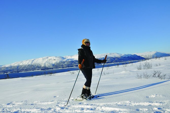 Guided Morning Snowshoe Hike with Huskies - The warm break: coffee, cake, and a fire you can feel in your face