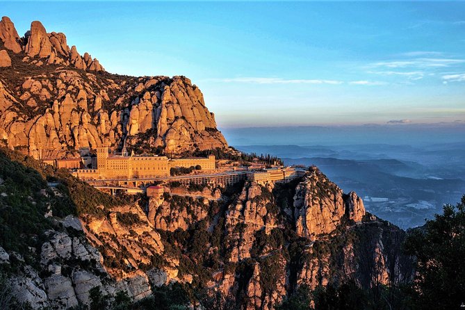 Montserrat Monastery with Easy Hike & Sitges Tour from Barcelona - Entering Abadia de Montserrat: basilica, atrium, and the wow factor
