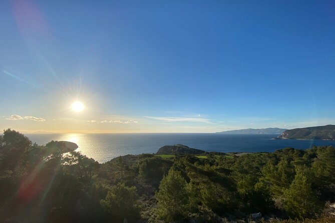 Small Group Hiking Sunset in Monolithos - The down route to the red-sand bay: where the day slows down