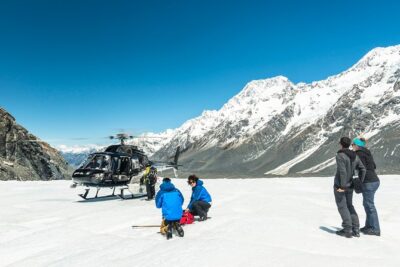 The Adventurer: Tasman Glacier Heli-hike - Landing on Tasman Glacier: fitting boots, crampons, and waterproof layers