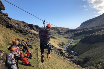 Zipline and Hiking Adventure Tour in Vík - Getting harnessed, then hiking into the first zip